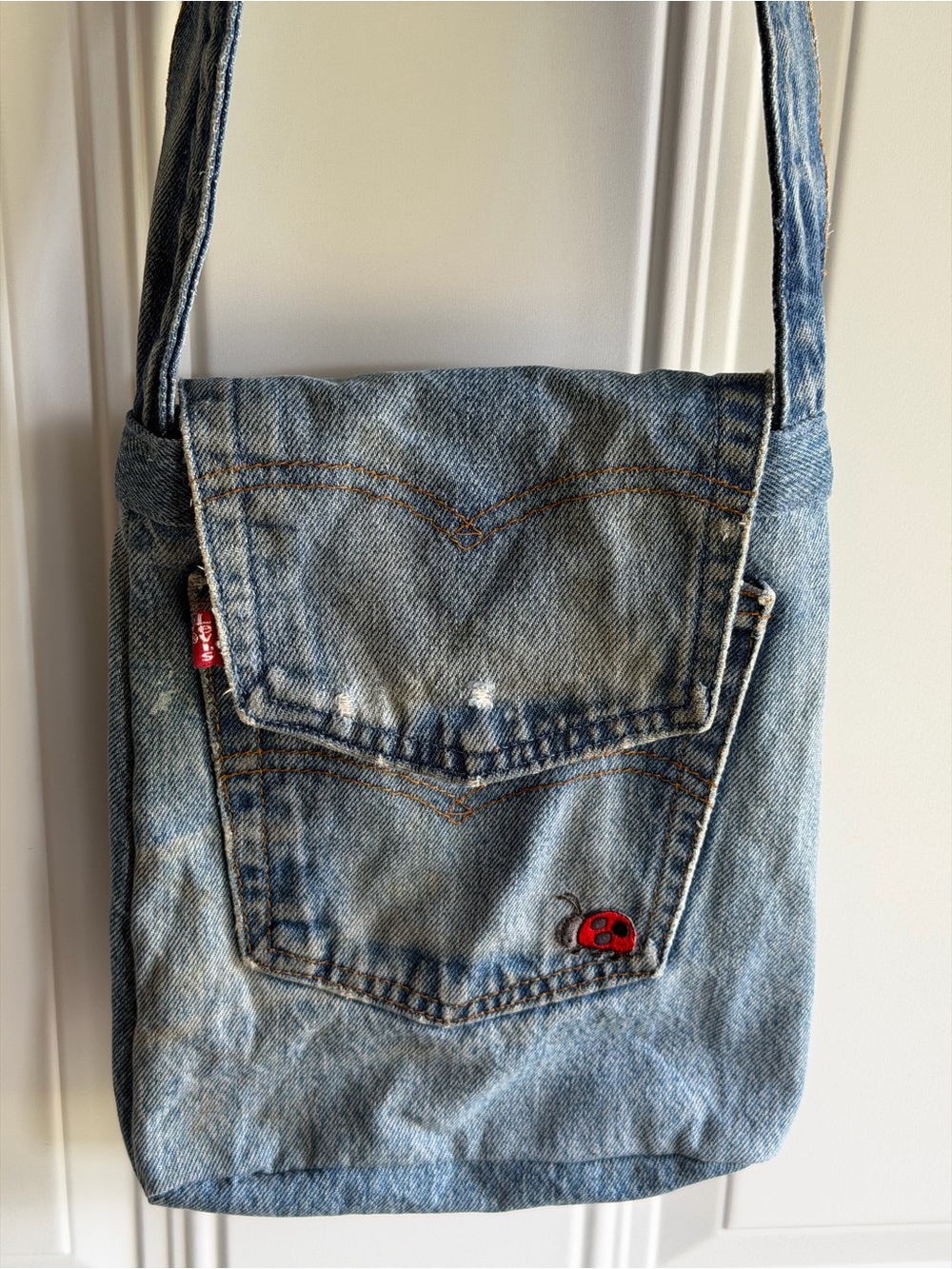 Levi's denim messenger bag w/ lady bug patch